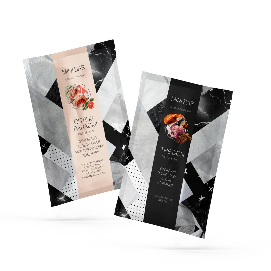 Two mini bar packages from Flowers on Norton St's Alcohol Tea-Bombs: one called "Citrus Paradisi," offering a blend of grapefruit and rosemary flavors, and another named "The Don," highlighting cinnamon and orange peel flavors. Each wrapper captivates with geometric and abstract artistry in black, white, and pink hues, reminiscent of an exquisite beverage.