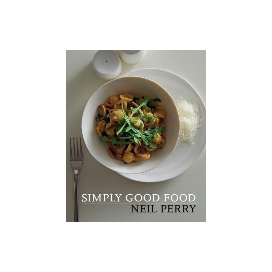 The cover of the "Simply Good Food" cookbook, a product by Flowers on Norton St, features an image of a white bowl filled with seasonal pasta and greens. The dish is elegantly presented on a white plate with accompanying details such as a small bowl of grated cheese, a fork, and salt and pepper shakers all set on a light gray surface.