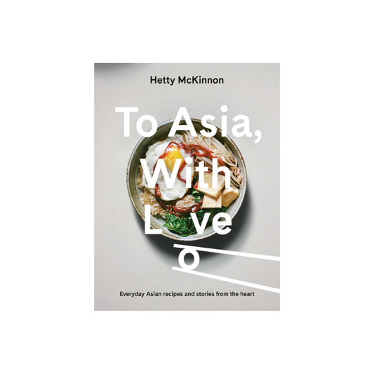 The cover of "To Asia with Love" by the brand Flowers on Norton St features a vibrant bowl of Asian cuisine, complete with rice, an egg, and vegetables. The text highlights: "Everyday Asian recipes and modern interpretations from the heart.