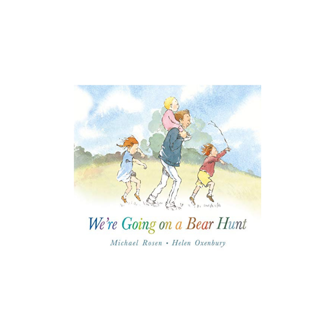 Illustration of a family with two adults and two children strolling through a grassy field, where the adult in front carries a child on their shoulders. The sky is blue with fluffy clouds. Text reads: "We're Going on a Bear Hunt," available under Baby Books by FlowersonNortonSt.