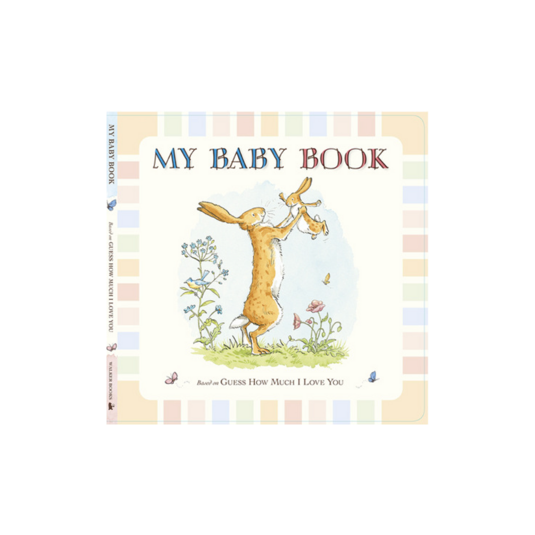 Cover of "Baby Books," a cherished children's classic by FlowersonNortonSt, showcasing a rabbit cradling a baby rabbit beneath a blue sky with flowers and grass. The border is adorned with pastel checks, and text at the bottom reads "Guess How Much I Love You.