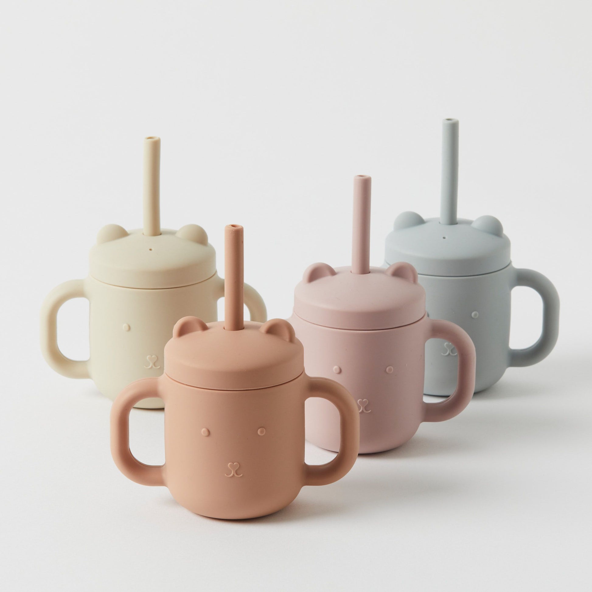 A collection of Flowers on Norton St's BPA-free Silicone Sippy Cups with straws.