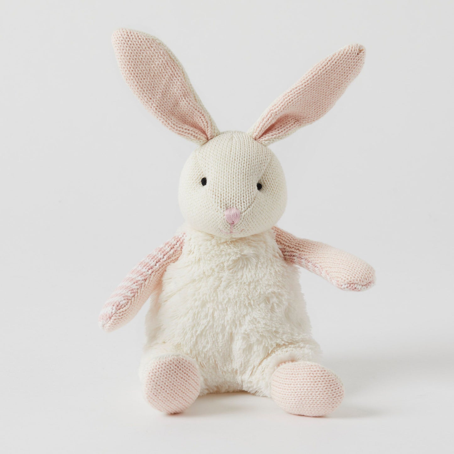 The Baby Bunnies plush toy by FlowersonNortonSt features ultra-soft cotton fur and adorable pink knitted ears and arms, sitting invitingly against a plain white background—perfect for cuddling.