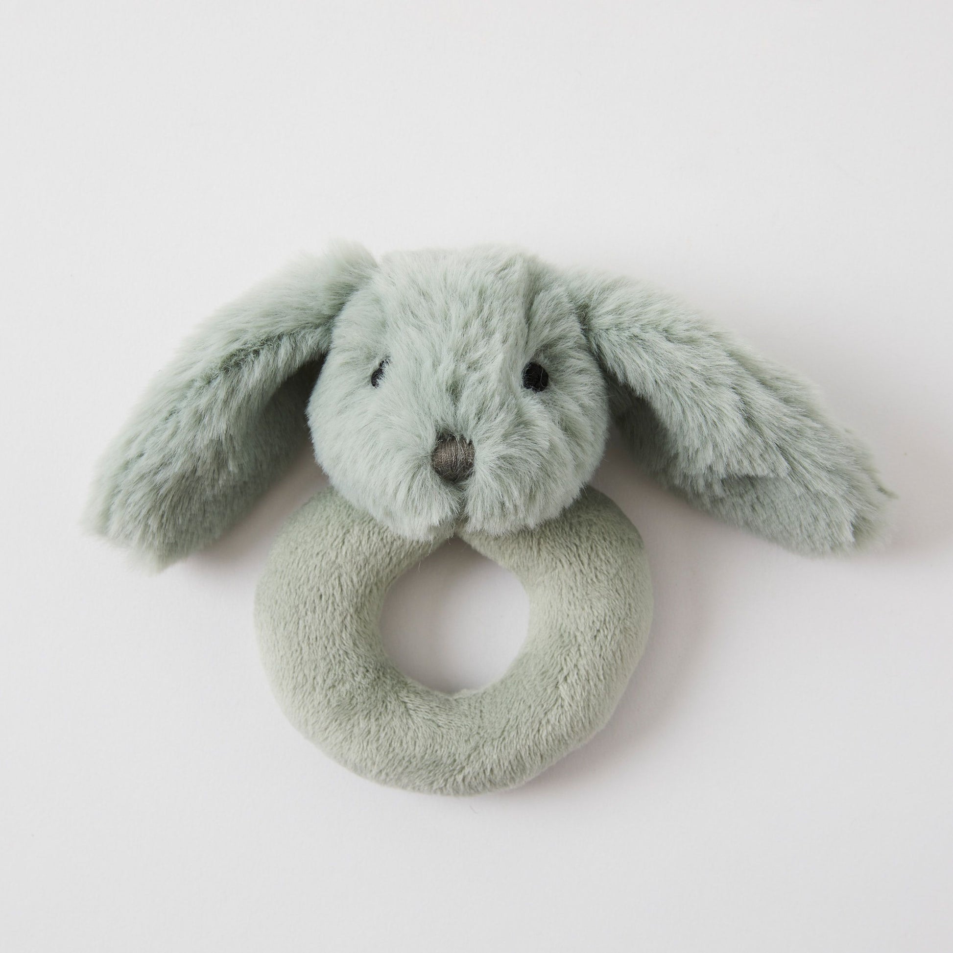 The Baby Bunny Rattle by FlowersonNortonSt is an ultra-soft plush bunny hand rattle with long ears and a gentle light grey color. Its ring-shaped body allows for easy gripping, making it an ideal gift for new parents. A pure white background accentuates its charming design.